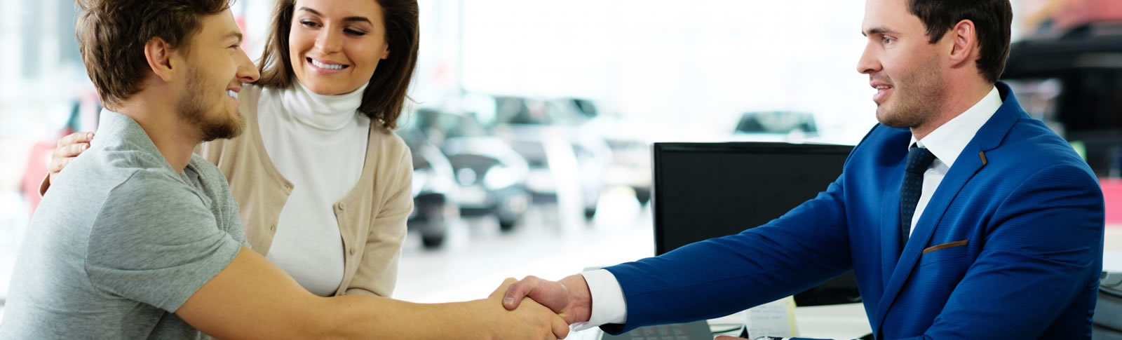 Banker shaking hands with a customer.