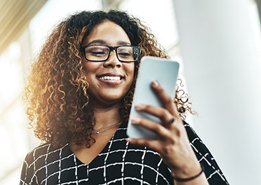 Woman walking using phone.