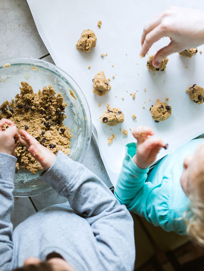 mom and kids making cookies