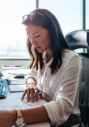 Woman working at desk.